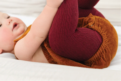 OEM & ODM knitting factory for cable knit baby & toddler tights. Combed cotton fabric, seamless toe, wide waistband, soft & breathable. Custom patterns & colors available. BSCI certified, comply with EU infant textile safety standards